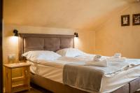Łóżko lub łóżka w pokoju w obiekcie Herbarium Bieszczadzkie Apartamenty