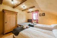 Łóżko lub łóżka w pokoju w obiekcie Herbarium Bieszczadzkie Apartamenty
