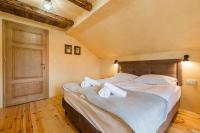 Łóżko lub łóżka w pokoju w obiekcie Herbarium Bieszczadzkie Apartamenty
