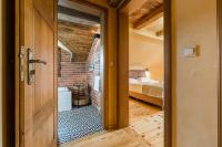 Łóżko lub łóżka w pokoju w obiekcie Herbarium Bieszczadzkie Apartamenty