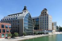 a group of buildings next to a body of water at Studio de charme in Pantin