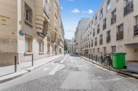 an empty street in a city with buildings at Renovated studio in the 6th district of Paris - Welkeys in Paris
