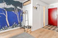 a room with a mural of trees on the wall at Renovated studio in the 6th district of Paris - Welkeys in Paris