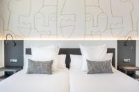 A bed or beds in a room at Climia Benidorm Plaza