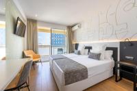 A bed or beds in a room at Climia Benidorm Plaza