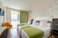 A bed or beds in a room at Climia Benidorm Plaza
