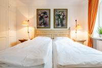 Postel nebo postele na pokoji v ubytování Residenz Bismarck Whg 22