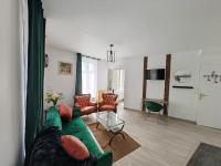 Posedenie v ubytovaní Cosy Appartement T2 proche Paris