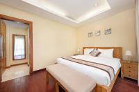 Ocean Villa Pool Retreat In Da Nangにあるベッド