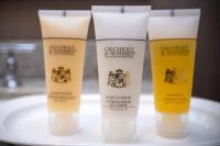 a group of three bottles of sunscreen on a sink at Sutton Place Hotel Revelstoke Mountain Resort in Revelstoke