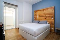 Postel nebo postele na pokoji v ubytování Alameda Guesthouse by Boutique Taipas Garagem para motos