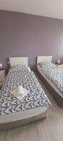 Posteľ alebo postele v izbe v ubytovaní Apartman Bloom