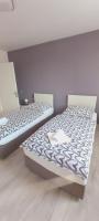 Posteľ alebo postele v izbe v ubytovaní Apartman Bloom
