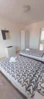 Posteľ alebo postele v izbe v ubytovaní Apartman Bloom