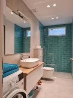 Kúpeľňa v ubytovaní Beachfront Comfort Apartments SINAJKO