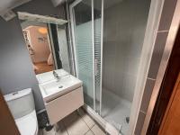 a bathroom with a shower and a sink and a toilet at Jupiter 3 YourHostHelper in Caen