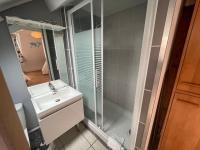 a bathroom with a sink and a shower at Jupiter 3 YourHostHelper in Caen