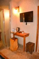 TV a/nebo společenská místnost v ubytování My Story Cave Hotel