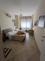Posteľ alebo postele v izbe v ubytovaní Napoli City Inn