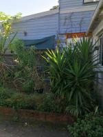 a garden in front of a house with plants at Chez Denis et Lucie in Saint-André