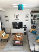 a living room with a couch and a coffee table at Appartement T2 Manoir de Malville in Nantes