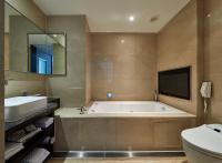 a bathroom with a tub and a toilet and a sink at The Tango Hotel Taipei Nanshi in Taipei