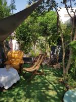 Vonkajšia záhrada v ubytovaní "Maison Fi", mer et centre à 2 pas,3 chambres privées, parties communes, Maison des années 80 jardin arboré