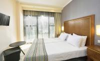 A bed or beds in a room at Mediterranean Resort