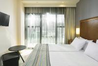 A bed or beds in a room at Mediterranean Resort