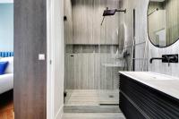 a bathroom with a sink and a mirror at Spacious &amp; Modern Home in Central Paris - 3BR8P - A40 in Paris