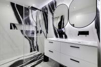 a bathroom with a white sink and a mirror at Spacious &amp; Modern Home in Central Paris - 3BR8P - A40 in Paris