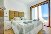 Postel nebo postele na pokoji v ubytování Villa Luisa Seaview 2 Casasol