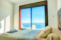 Postel nebo postele na pokoji v ubytování Villa Luisa Seaview 2 Casasol