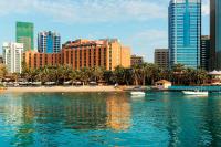 a view of a city with a beach and buildings at Sheraton Abu Dhabi Hotel & Resort in Abu Dhabi