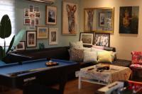 a living room with a couch and a pool table at Star Wish B&amp;B in Dongshan