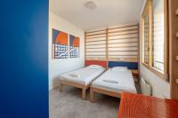 a bedroom with two beds and a window at UCPA SPORT STATION HOSTEL PARIS in Paris