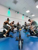 a group of people riding on bikes in a gym at UCPA SPORT STATION HOSTEL PARIS in Paris