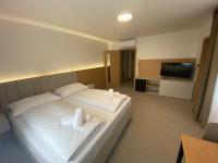 Postel nebo postele na pokoji v ubytování Comfort Pálava, Penzion Klentnice - Mikulov - Pálava