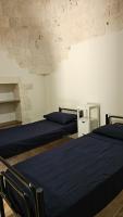 A bed or beds in a room at Vacanza In Puglia