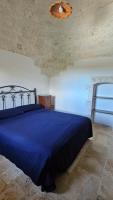 A bed or beds in a room at Vacanza In Puglia