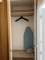 a closet with a door open with a pillow in it at Studio de charme in Pantin