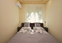 Posteľ alebo postele v izbe v ubytovaní Kinder Apartman