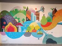 a wall with a mural of different fruits and vegetables at Windmill Inn in Solan