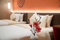 Guangzhou Wogo Yuanbao Hotel-Zhujiang New Town-Free Canton Fair Shuttle Bus & Overseas Buyer Registration Servicesにあるベッド