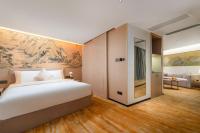 Guangzhou Wogo Yuanbao Hotel-Zhujiang New Town-Free Canton Fair Shuttle Bus & Overseas Buyer Registration Servicesにあるベッド