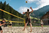 a group of people playing volleyball on a beach at Berghaus Schröcken - Hotel Apartments Spa in Schröcken