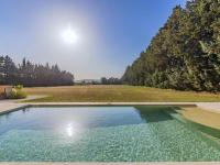 a swimming pool in the middle of a field with trees at Holiday Home Le Mas de Marius by Interhome in Cavaillon