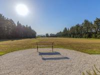 a bench sitting on top of a large field at Holiday Home Le Mas de Marius by Interhome in Cavaillon