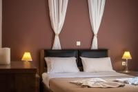 A bed or beds in a room at Stratos - Maria House