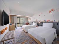 Hilton Garden Inn Guangzhou Tianheにあるベッド